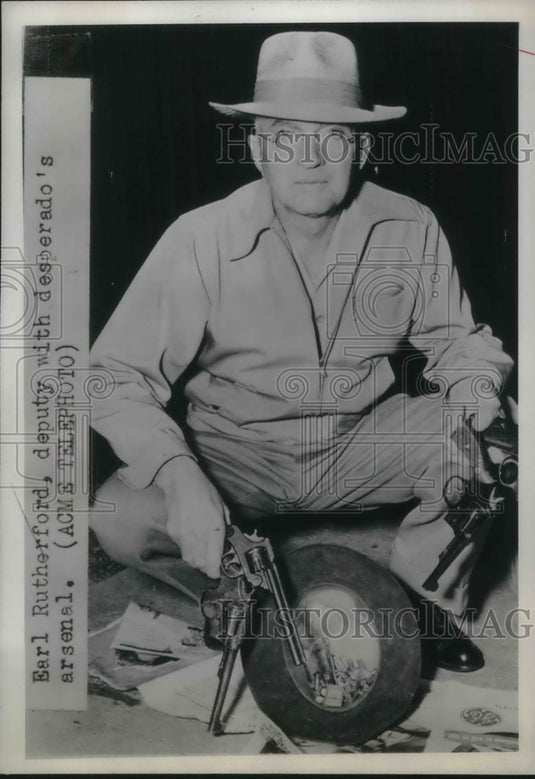 1949 Earl Rutherford deputy with desperado's arsenal - Historic Images