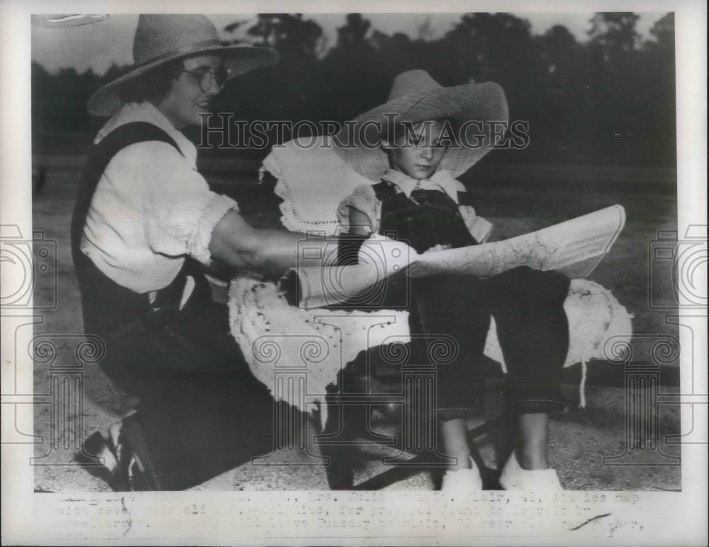 1949 Press Photo Mrs. Roka St. Clair with son Adolphius studies map - Historic Images