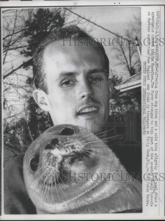 1963 Raleigh, NC Jim Knowlton & a lost seal pup he rescued - Historic Images