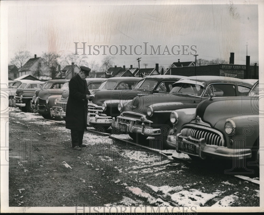 1950 Pat David Bollinger, traffic cop ticketing cars in Cleveland, - Historic Images