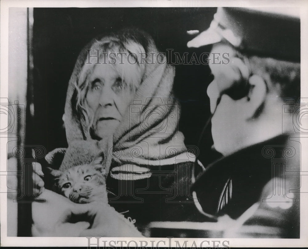 1953 Miss Fowler, 84, after dramatic rescue from her flooded home - Historic Images