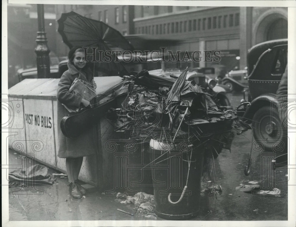 1932 Umbrellas suffer after heavy rainstorm with high winds - Historic Images