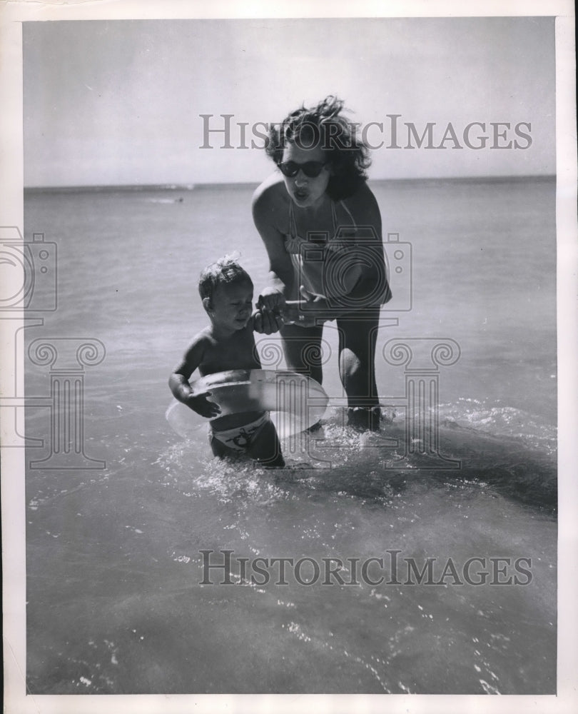 1947 little man in ocean wants left down - Historic Images
