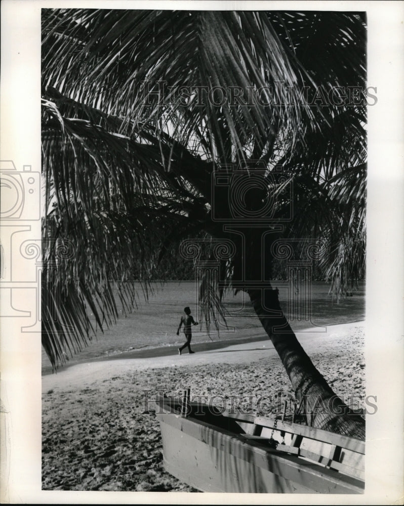 1961 Press Photo Native enjoys beach at Magen&#39;s Bay - nec34998 - Historic Images