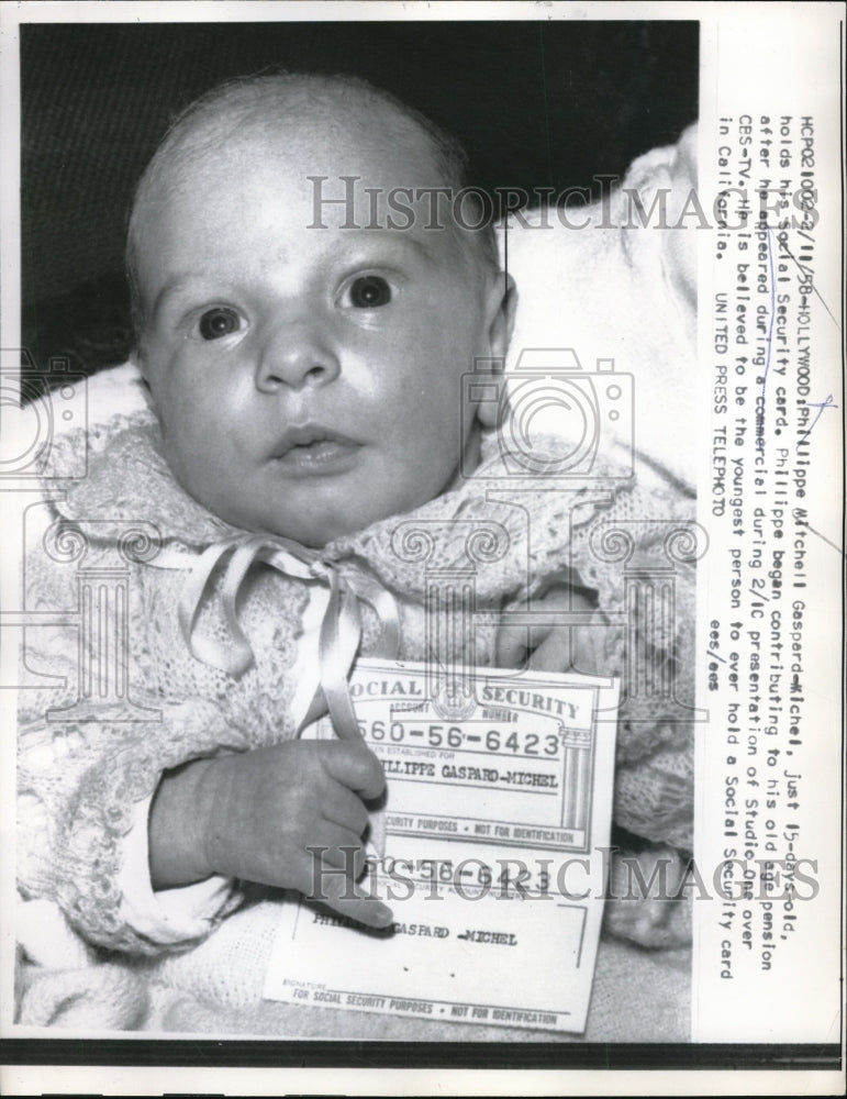 1958 Press Photo Hollywood Phillippe Mitchell Gaspard Child Holding Social Sec-Historic Images