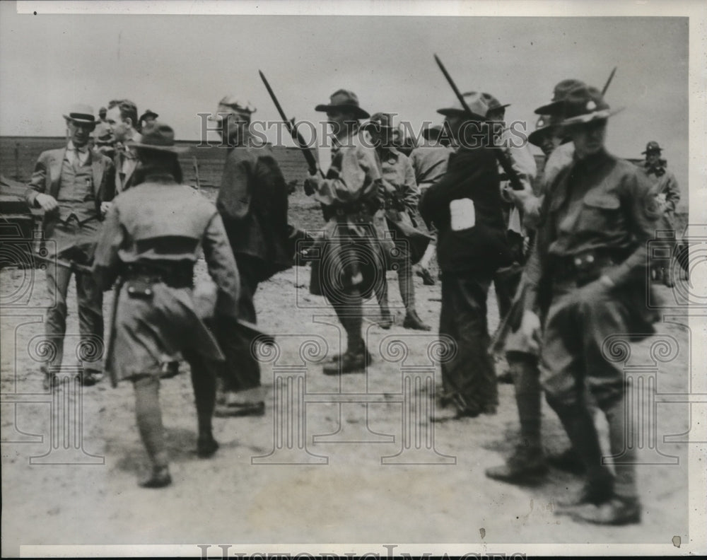 1933 Press Photo 12 seized by troops in Iowa riot zone. Frank North - nec35685 - Historic Images