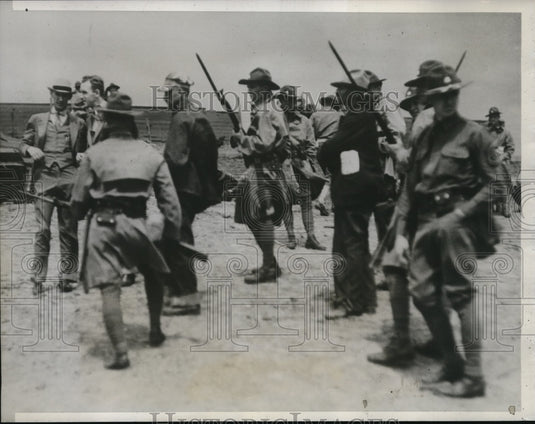 1933 Press Photo 12 seized by troops in Iowa riot zone. Frank North - nec35685 - Historic Images