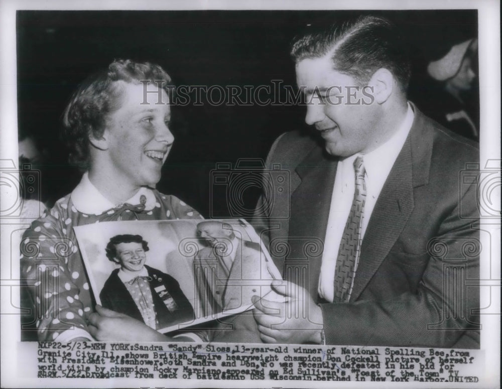 1955 Sandy Sloss Natl. Speeling Bee winner with Boxwer Don Cockell. - Historic Images