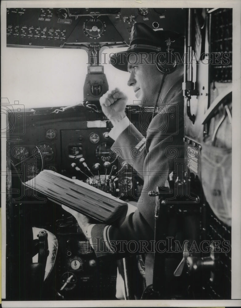 1937 Elmer Gorman, TWA 1st officer in cockpit of plane - Historic Images