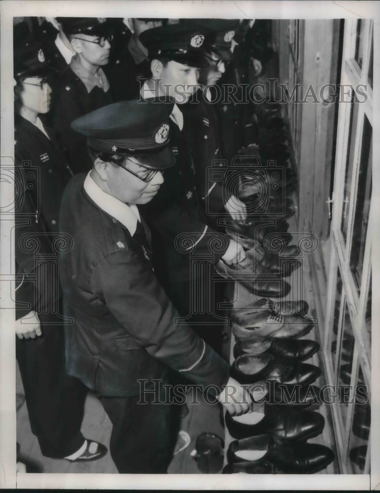 1948 Tokyo Police College shows depositing their shoes outside classroom - Historic Images