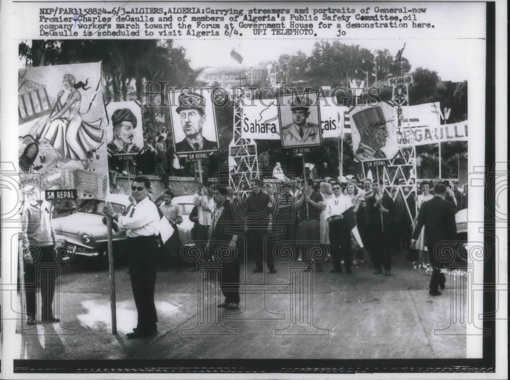 1958 Press Photo Oil Company Workers carries portraits of Charles deGulle. - Historic Images