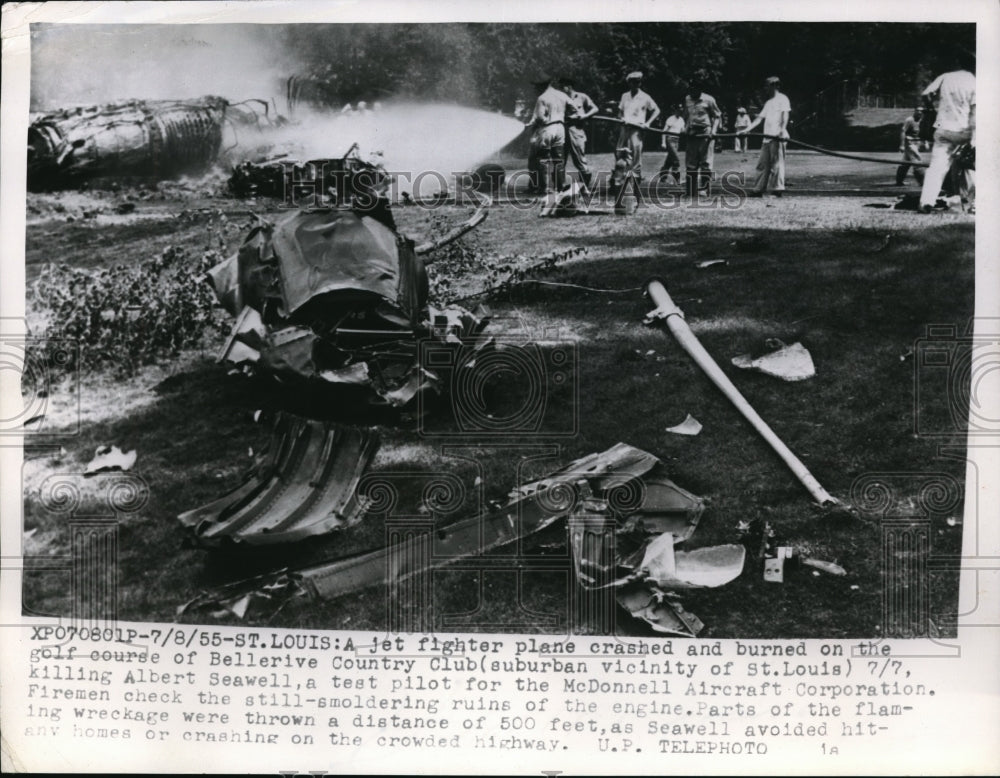 1955 Press Photo Firemen putting blaze out of jet fighter plane crashed - Historic Images