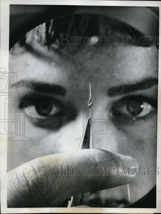 1962 Press Photo Colleen Thoensen taking a close look at a diode - Historic Images