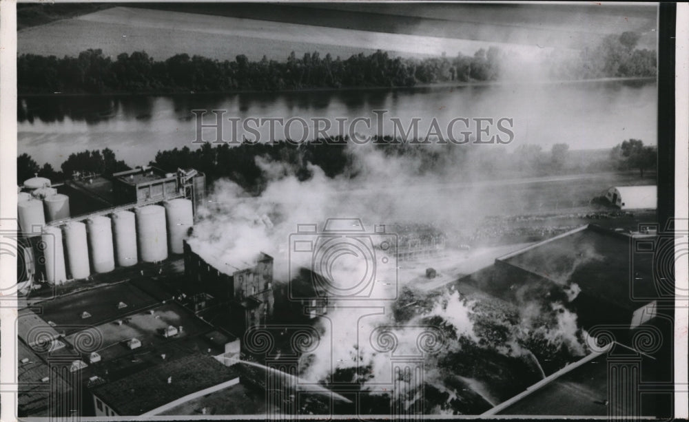 1954 Press Photo Aerial of American Distillery Warehouse on Fire in Pekin, IL - Historic Images