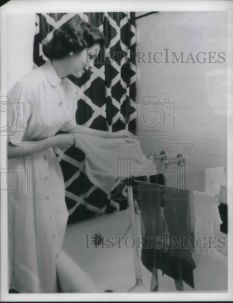 1957 Drying clothes on a rack.-Historic Images