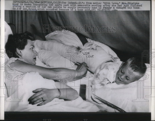 1958 Press Photo Ethelyne Love Signs Son's Cast After Pelvic Donation - Historic Images