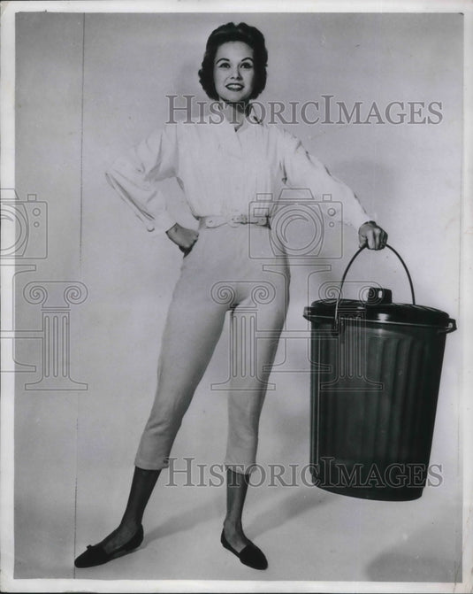 1958 Press Photo Dallas model eith trash pails by Lome Plastics Co - nec49032 - Historic Images
