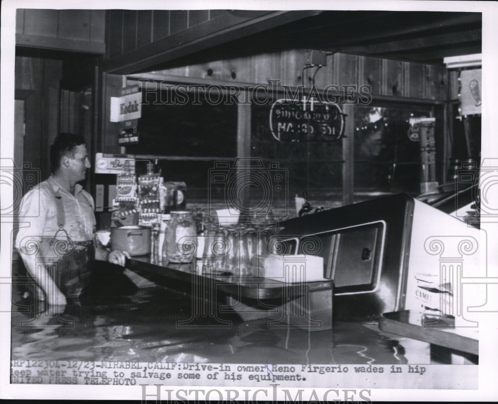 1955 Press Photo Drive-In owner Reno Firgerio in deep water salvaging equipment. - Historic Images