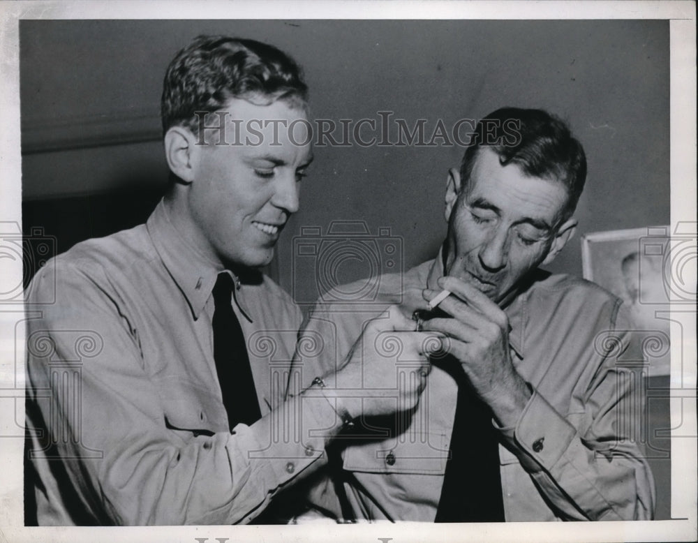 1945 Press Photo Lt. William Lineberry Jr. Lights Cigarette for Capt. Lineberry - Historic Images