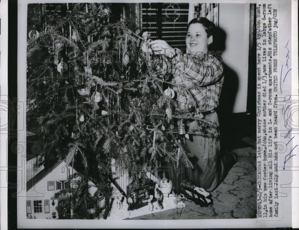 1955 Press Photo Boy John Hunt Decorates Christmas Tree In New Foster Home - Historic Images