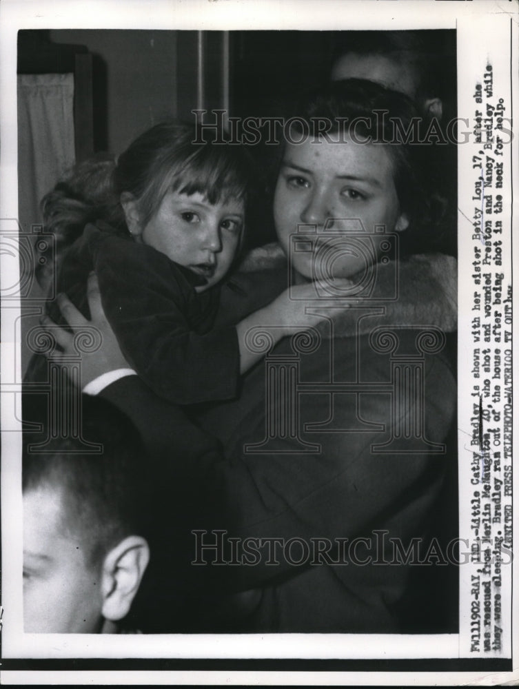 1957 Press Photo Little Cathy Bradley rescued from Merlin McNaughton - Historic Images