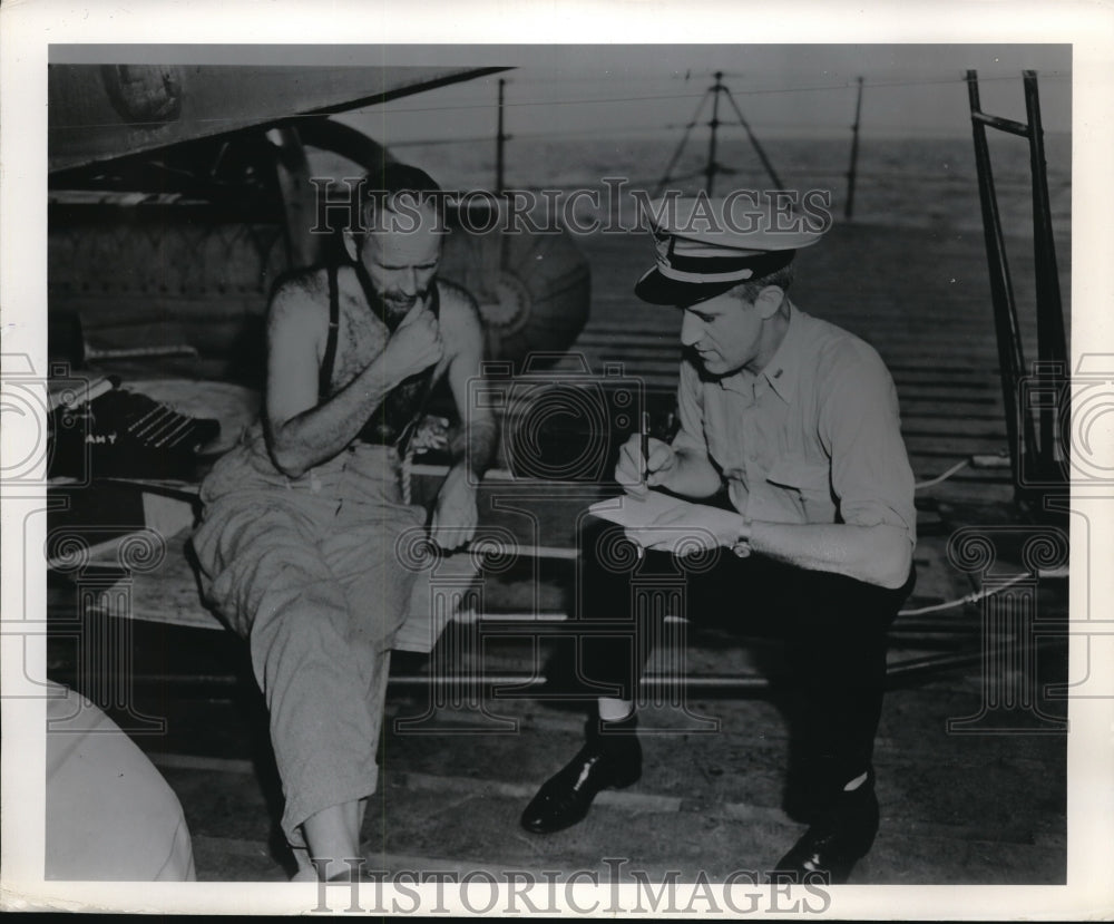 1946 Press Photo Chief photographer, USCG interviews Albert Taylor, physicist. - Historic Images