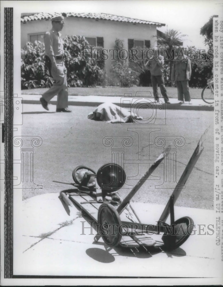 1961 Press Photo body covered/killed when coaster was hit by car - Historic Images