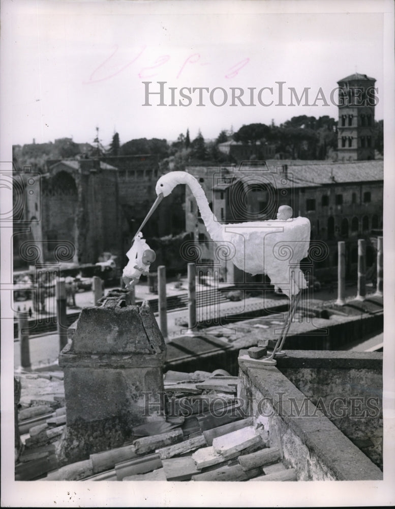 1953 Stork sculpture delivering babies in Rome, Italy-Historic Images