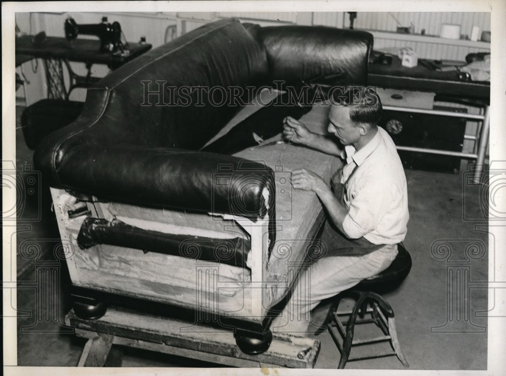 1938 Press Photo Louis Guido reupholstering Denator Alden Barkley Couch. - Historic Images