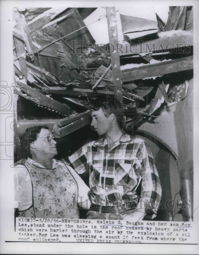 1956 Press Photo Melvin G. Baugh, and son Roy of Newton with hole in roof from - Historic Images