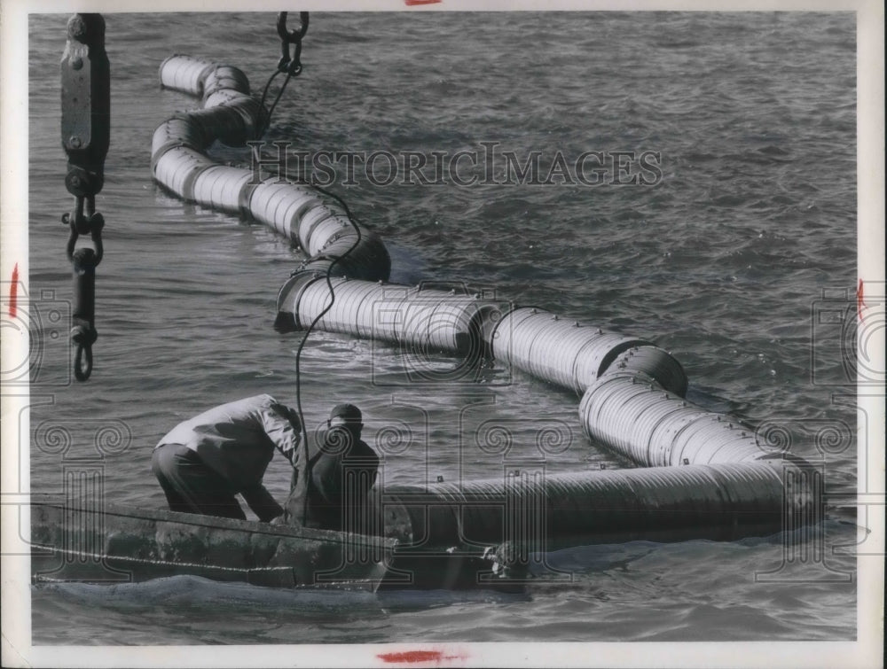 1968 Press Photo Removing poisonous oil &amp; fabric barriers curtain - nec58769 - Historic Images