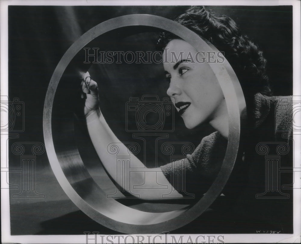 1953 Press Photo Margaret Steiner Checks Quality Of Metal Ring - Historic Images