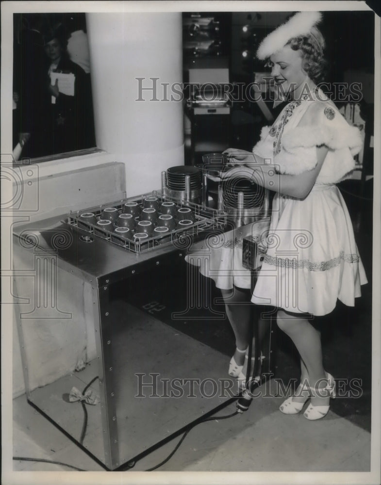 1939 Automatic cup and saucer dispenser at theNational Restaurant - Historic Images