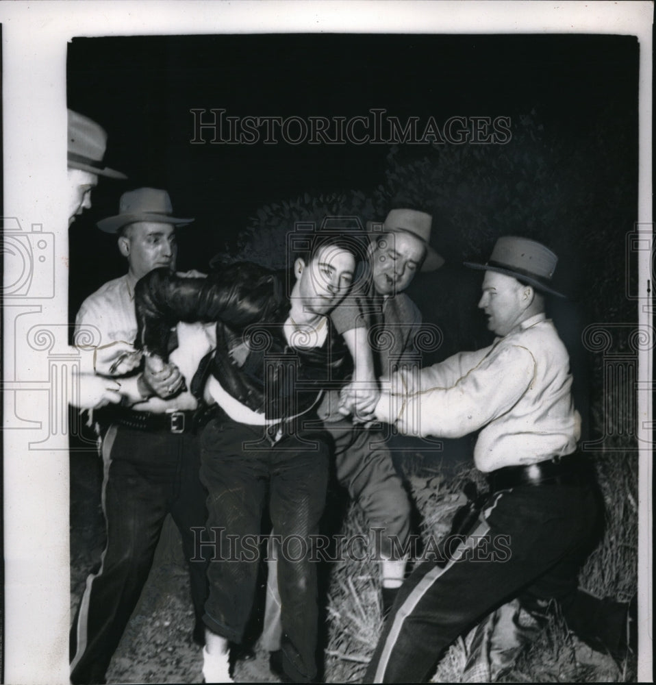 1956 Robert Burst handcuffed after driving a Stolen Mass. Car. - Historic Images