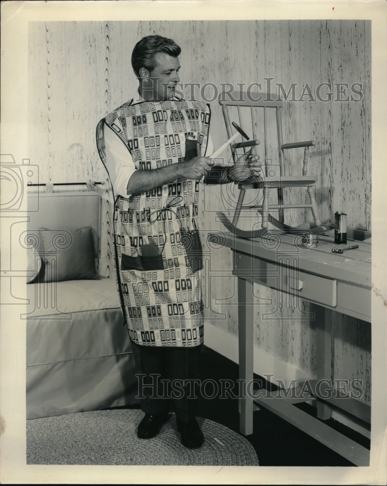 1958 Press Photo Man builds a childs rocking chair homemaking - Historic Images