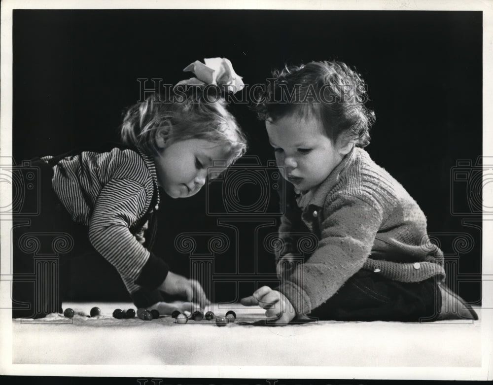 1940 Press Photo Two youngsters playing with their toys - Historic Images