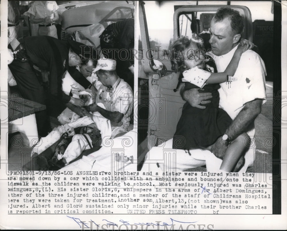 1956 Press Photo Dr. Albert Dominguez with Injured Children Charles and Gloria - Historic Images