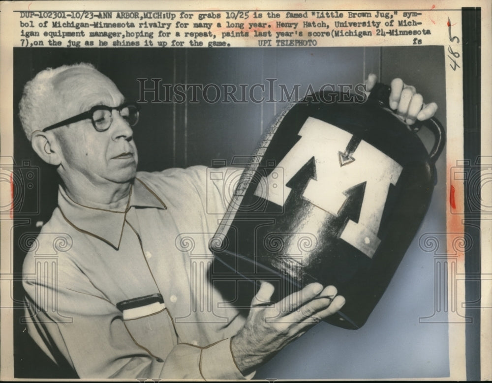 1958 The &quot;Little Brown Jug,&quot; symbol of Michigan-Minnesota rivalry for many years.-Historic Images