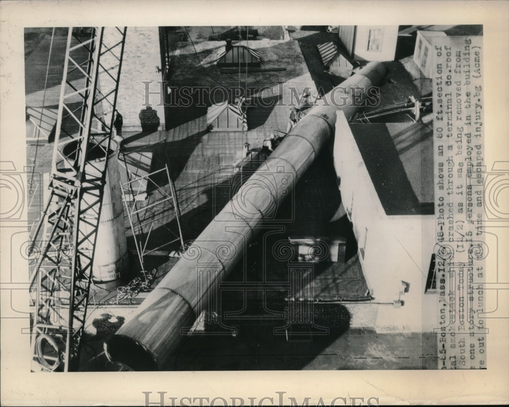 1948 Press Photo Boston, Mass smokestack that crashed thru a terminal roof - Historic Images