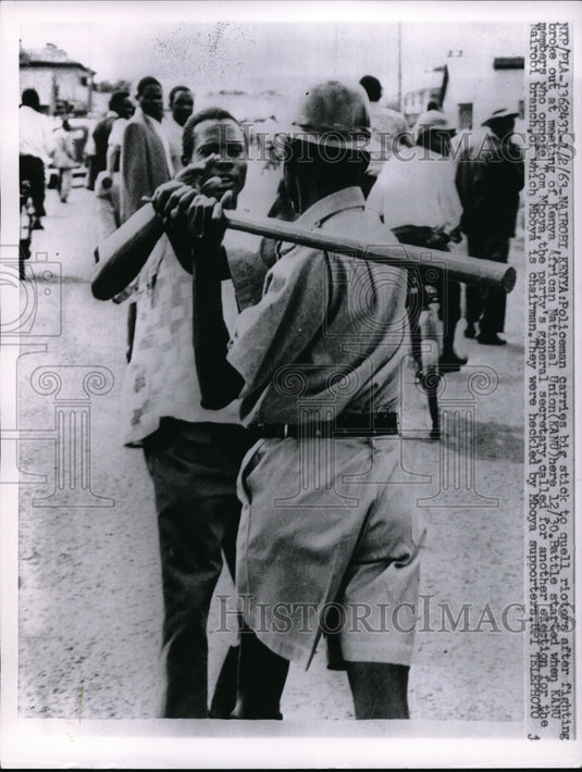 1963 Press Photo Nairobi, Kenya policeman with bat to quell rioters - nec67641 - Historic Images