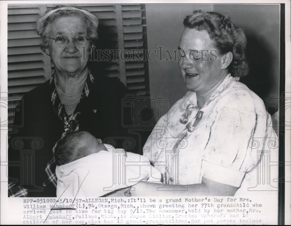 1957 Press Photo Mrs William Wahmhoff greeting her 77th grandchild - Historic Images