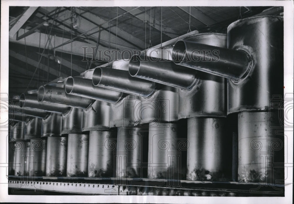 1954 Press Photo Fire Pots Rolling Off Assembly Line at Lennox Furnace Company - Historic Images