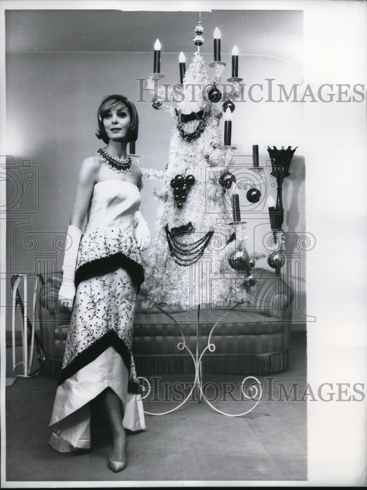 1960 Trimmed with glittering paillettes and richly embroidered Gown.-Historic Images