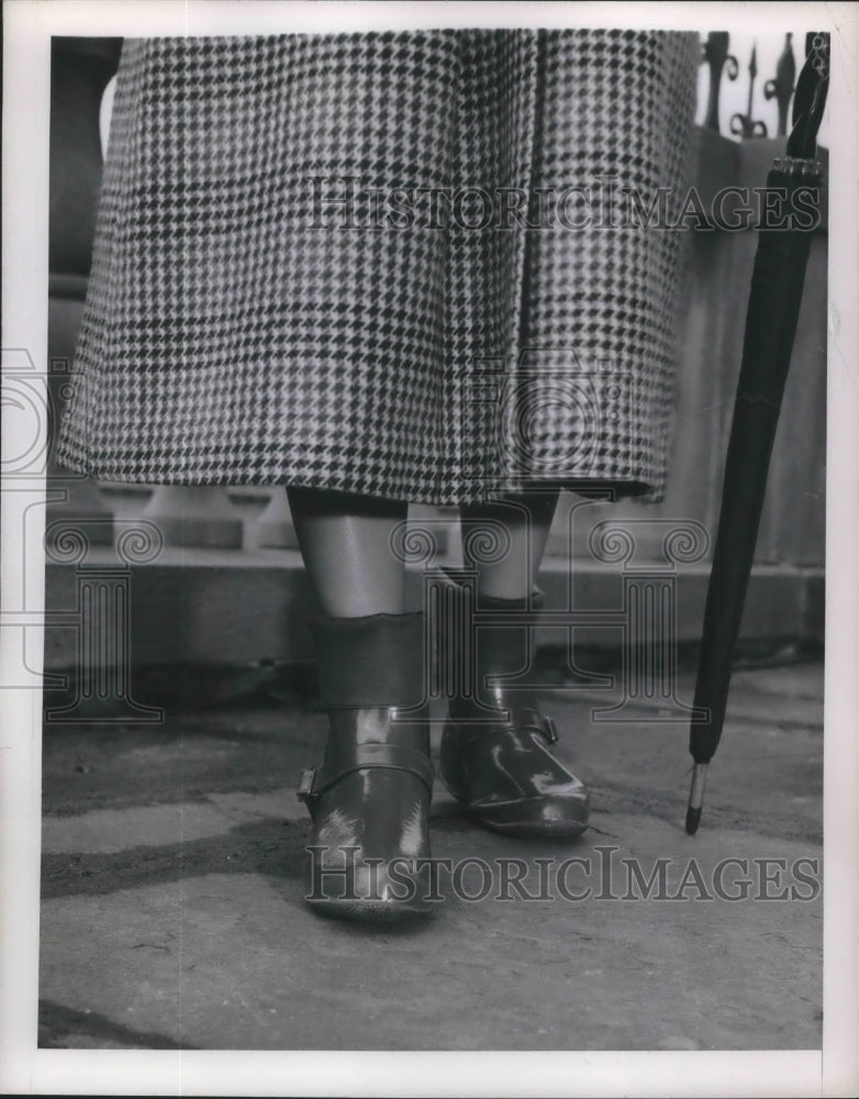 1949 Ladies rubber rain boots on a model - Historic Images