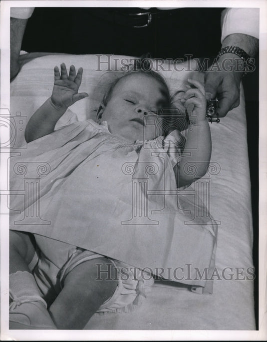 1957 infant given hearing test at Children's Services in Cleveland - Historic Images