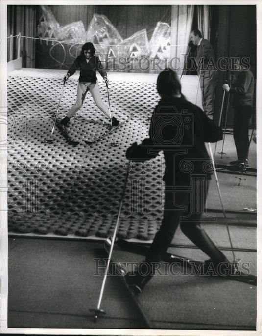 1962 Press Photo The student slides down as instructors observe her effort - Historic Images