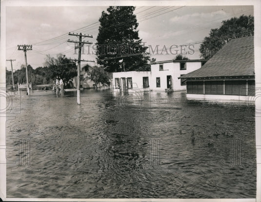 1938 Press Photo Boston, Mass Charles River floodwaters inundate Millis - Historic Images