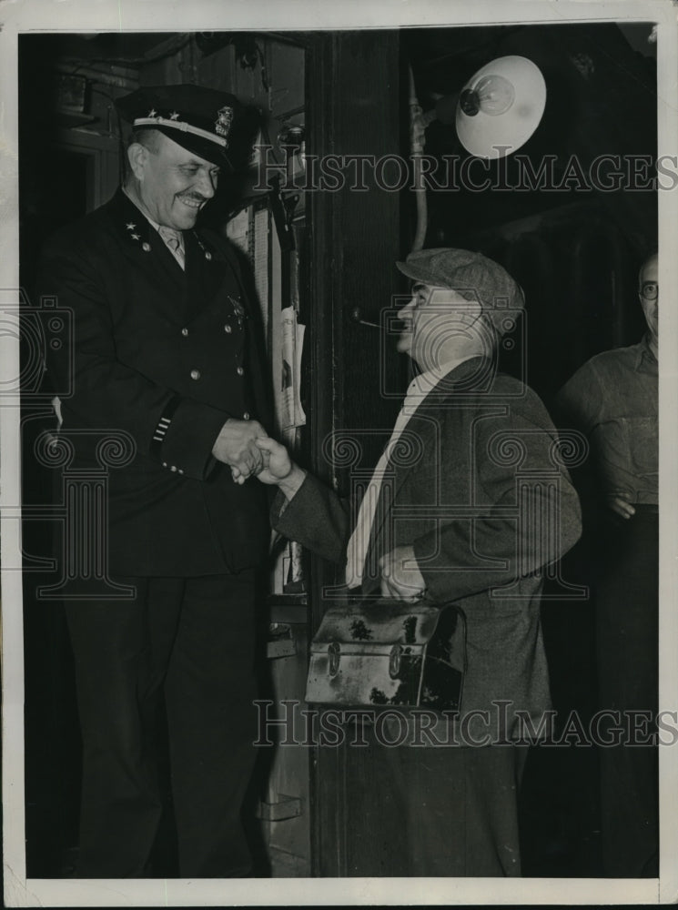 1937 Worker Robert Lilly being welcomed by Capt. Steve Martenov - Historic Images