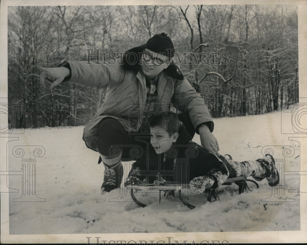 Press Photo Philip Breen of Grandview Road and Son Michael on Sled in Snow - Historic Images