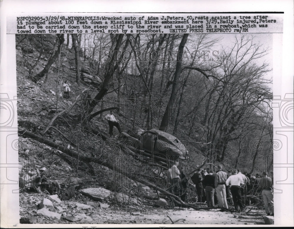 1958 Press Photo Minneapolis MN Wrecked auto of Adam Peters on river bank - Historic Images